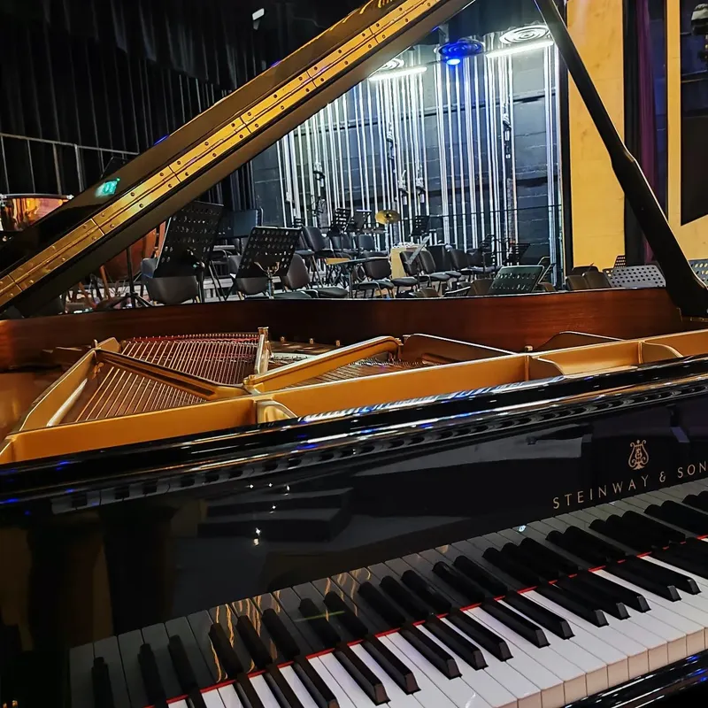 A Steinway & Sons concert grand prepared on stage